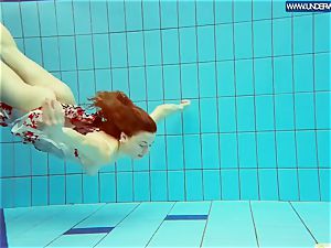 torrid grind red-haired swimming in the pool